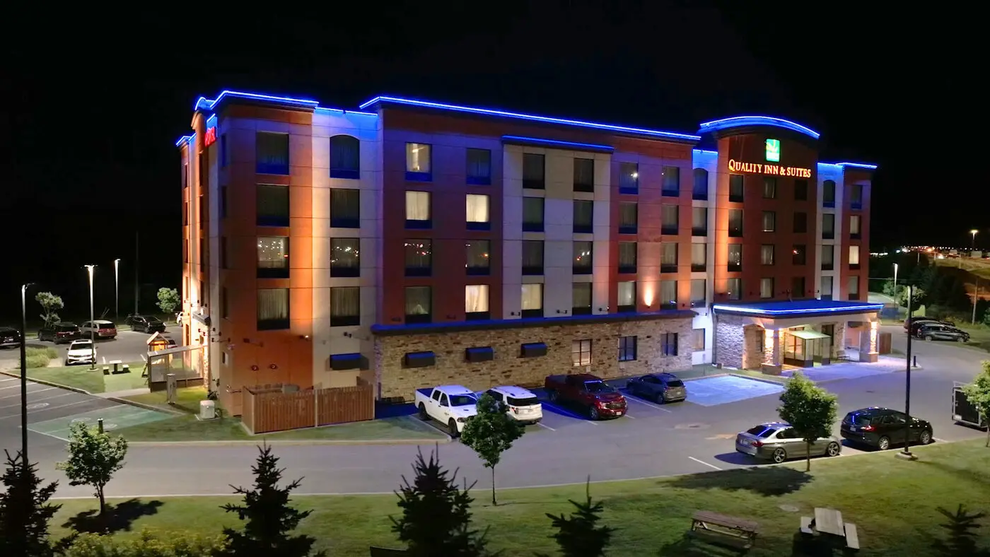 Apartment building lit at night in winter