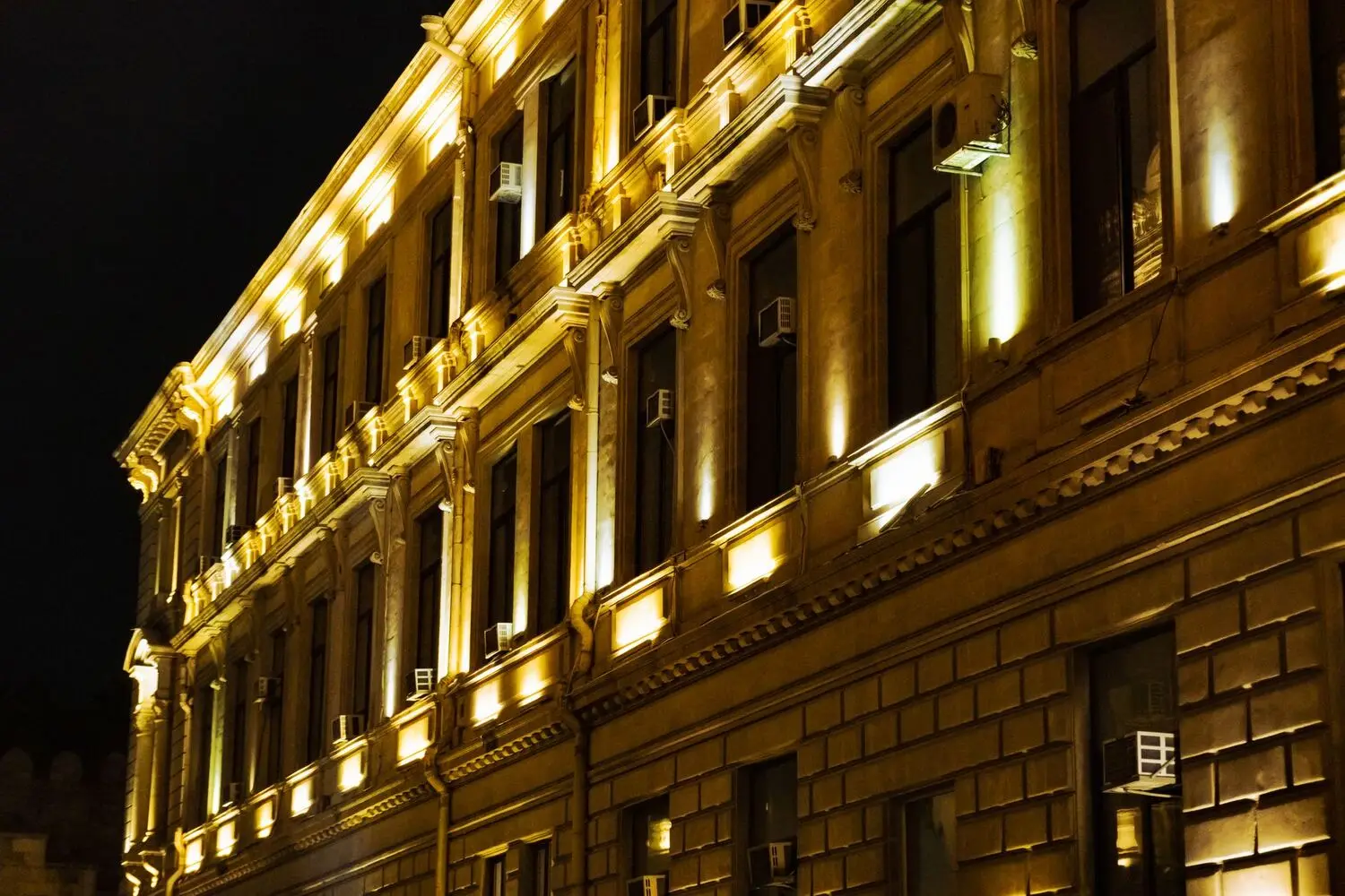 Village heritage facade lit warm at night